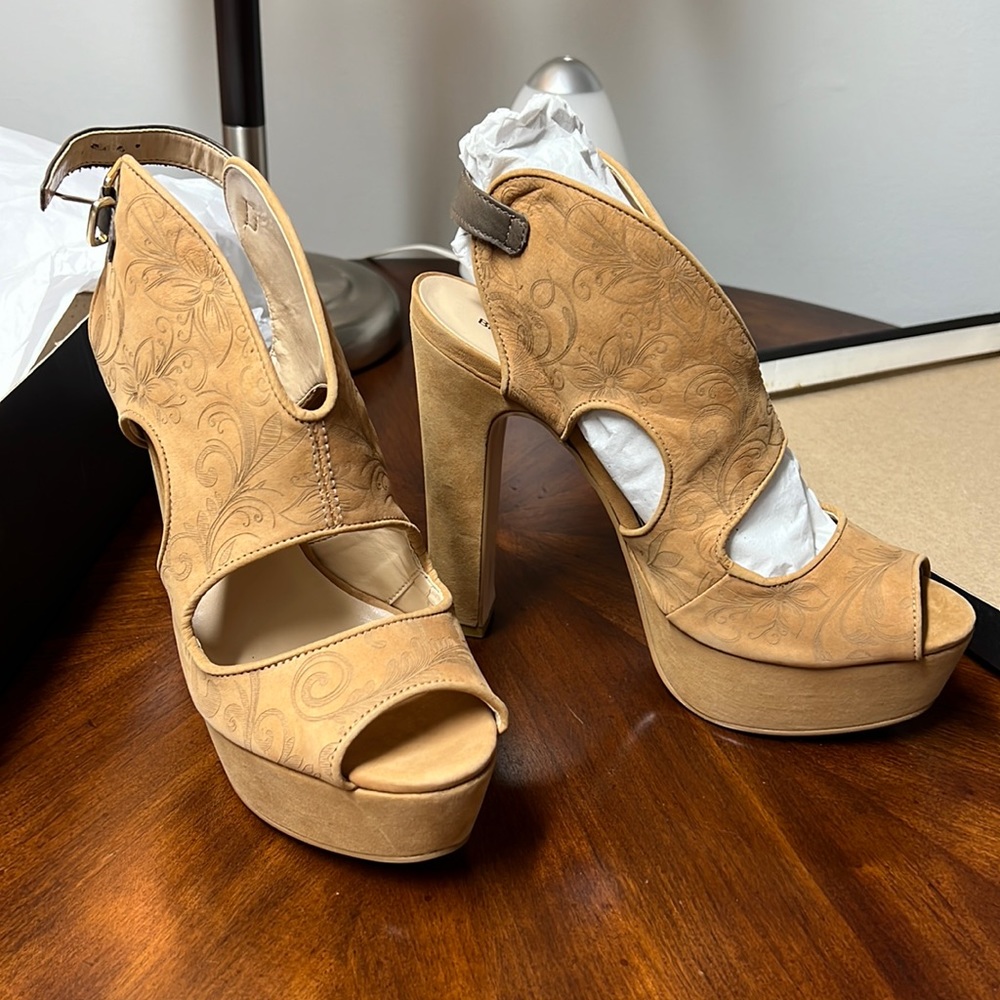 Bruno Menegatti leather high heel platform sandals.